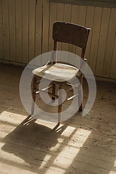 Wooden antique chair and sunlight