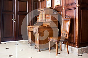 wooden antique secretaire or bureau in a house - retro furniture interior