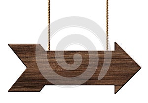 Wooden arrow shape signpost or signboard made of dark wood hanging on ropes