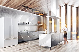 Wooden attic kitchen with fridge, woman