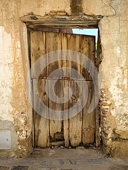 Wooden back door of an abandoned town house