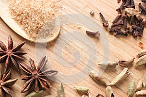 Wooden background with aromatic spices