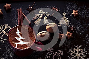 Wooden background with cup of hot coffee and gift wrapping of Christmas cookies