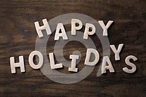 Wooden Background Happy Holidays Written With Cookie Dough