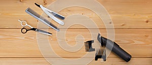 wooden background. items are for cutting hair. menfolk. electra hair clipper.