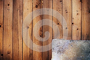 Wooden background with metal plate