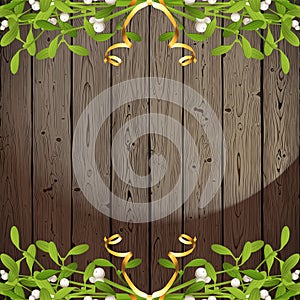 Wooden background with mistletoe