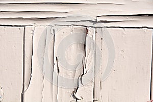 wooden background with old white paint. The old wall