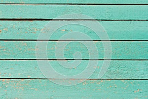 Wooden background, old wooden wall, painted blue, with slits and nails