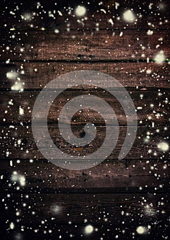 Wooden background, painted with the falling snow, toned image, s photo