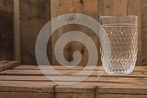 Rococo cristal glass on a wooden table photo