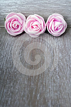 Wooden background with roses