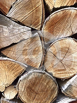 Wooden background. Side view of a pile of firewood.