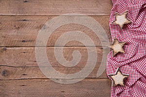 Wooden background with stars and a red checkered frame