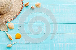 Wooden background for summer holiday and vacation concept.Beach accessories including sunglasses, hat beach, shell, green