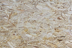 Wooden background.Textured wooden background made of pressed wood shavings of natural color