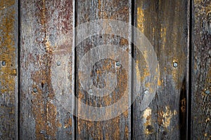 wooden background with weathered wood and ruusty nails