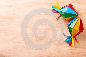 Wooden background with wicker hat for brazilian festivel Festa Junina