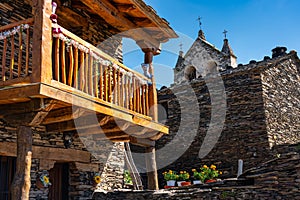Wooden balconies and stone houses on the route of the black villages, Guadalajara, Majaelrayo. photo