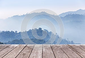 Wooden balcony terrace floor on viewpoint high tropical rainforest mountain in the morning