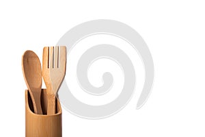 Wooden bamboo kitchen utensils isolated on white background copy space