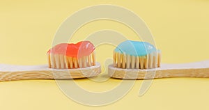 Wooden bamboo toothbrush with toothpaste photo