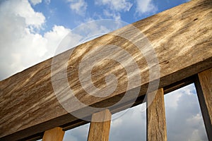 Wooden Banister & Blue Cloudy Sky