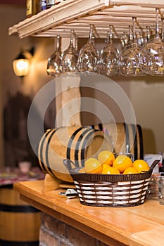 Wooden bar in a pub with a lemons in basket