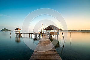 Wooden bar in sea and hut with clear sunrise sky in Koh Mak at Trat, Thailand. Summer, Travel, Vacation and Holiday concept