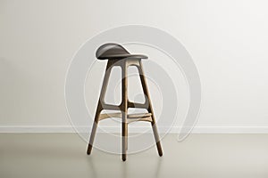 Wooden bar stool with a molded leather seat photo