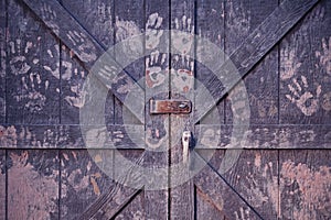 Wooden barn doors with handprints