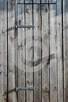 Wooden barn doors with metal hinges