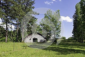 Wooden barn in spring landscape