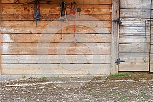 Wooden barn wall with wooden closed door