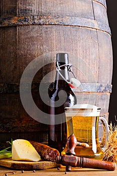 Wooden barrel with beer and food