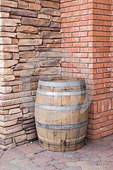 Wooden barrel and brick and stone walls