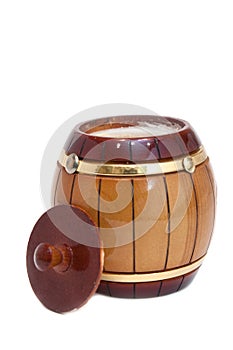 Wooden barrel with honey on a white background