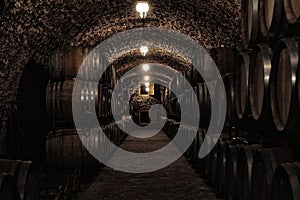 Wooden barrels with whiskey photo