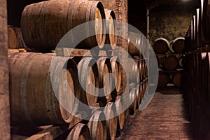 Wooden barrels for wine aging in the cellar..Italian wine