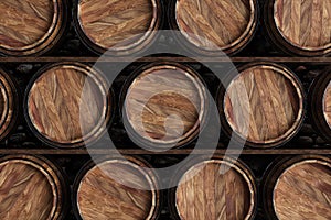 Wooden barrels for wine on a black background. Winemaking, wine. The concept of the production of alcoholic beverages. 3D