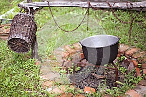 Wooden basket and a cast iron cauldron