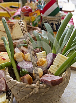 Wooden basket filled with traditional meat products