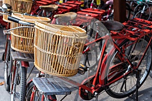 wooden basket on red bicycle