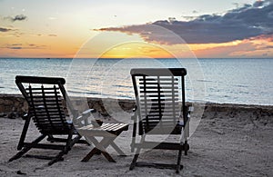 Wooden Beach Chairs overlooking sunset at Holbox Island