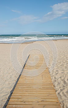 Wooden beach pathway to the ocean