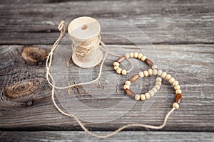 Wooden beads, spool of thread, accessories for needlework