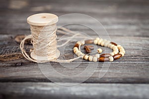 Wooden beads, spool of thread, accessories for needlework