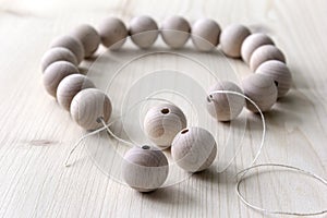 Wooden beads on a wooden background