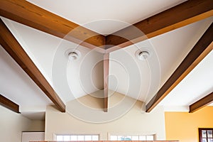 wooden beams intersecting in pueblo ceiling corner