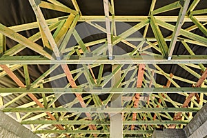 Wooden beams at roof of new house building construction site